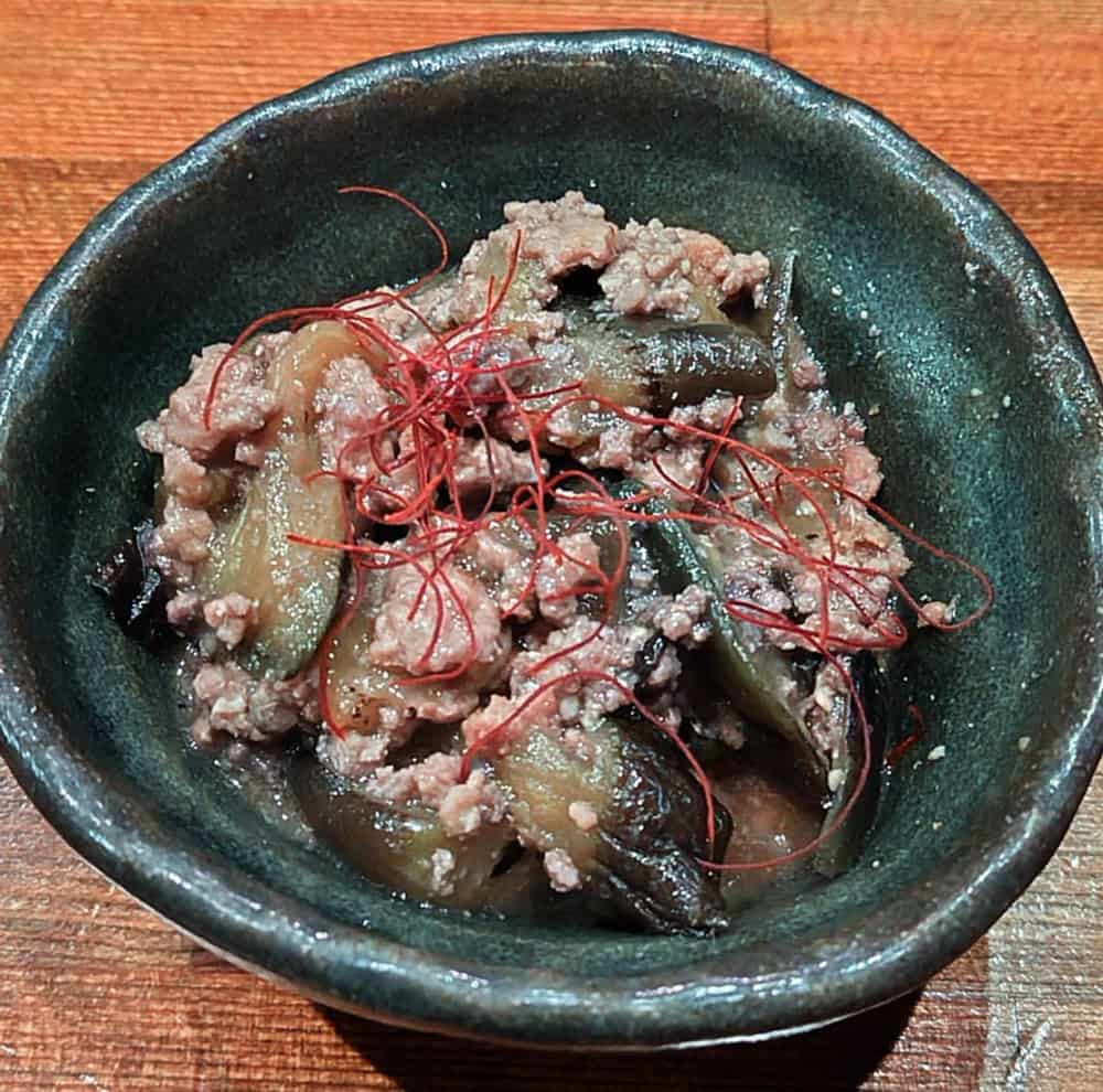 酒処たかはしで食べた「茄子味噌ひき肉炒め」の写真
